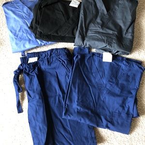 4 sets of scrubs- only worn once!
